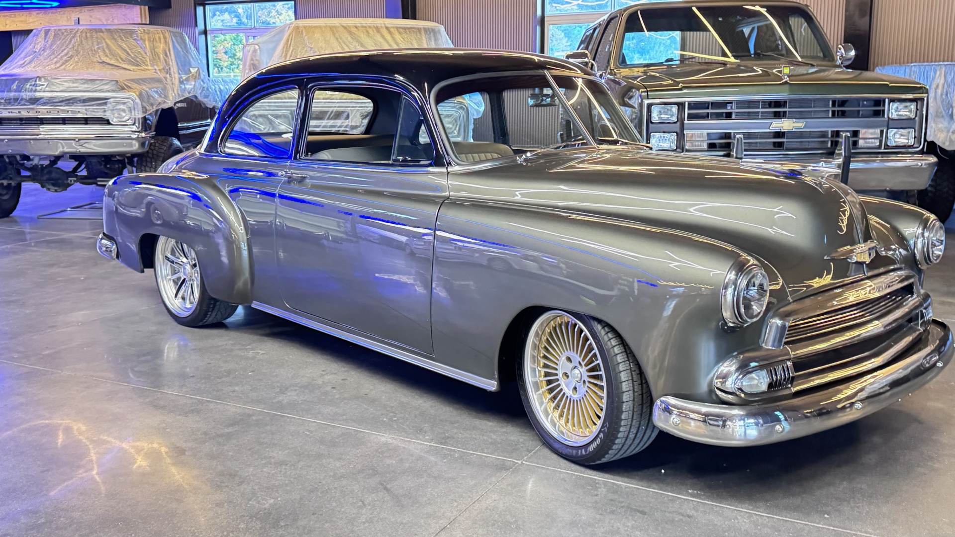 Silver Chevrolet coupe with custom wheels