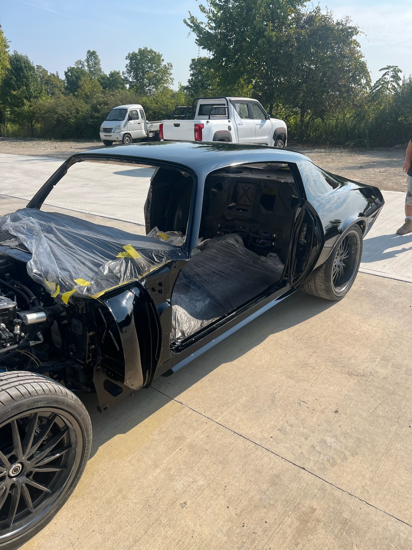 Fresh black paint on Camaro reassembly
