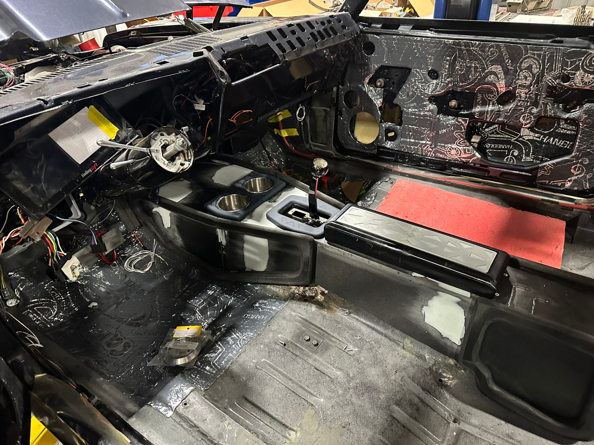 Stripped interior with sound deadening and custom console