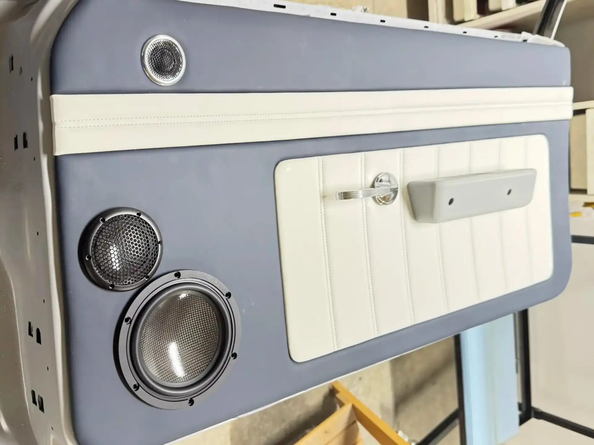 Custom blue and white door panel with three-way speakers